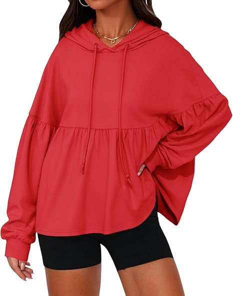Solid color hooded top with large ruffled sleeves