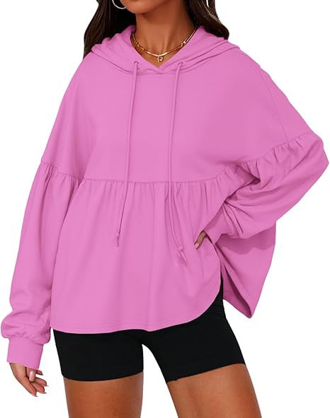 Solid color hooded top with large ruffled sleeves